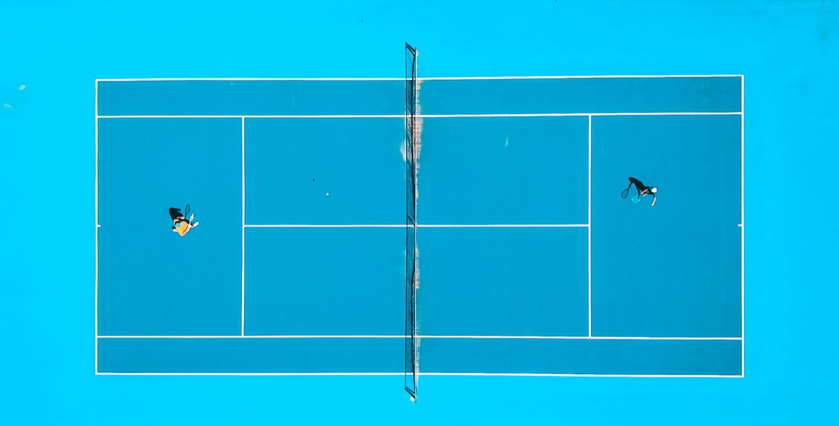 A bright blue hard court from above